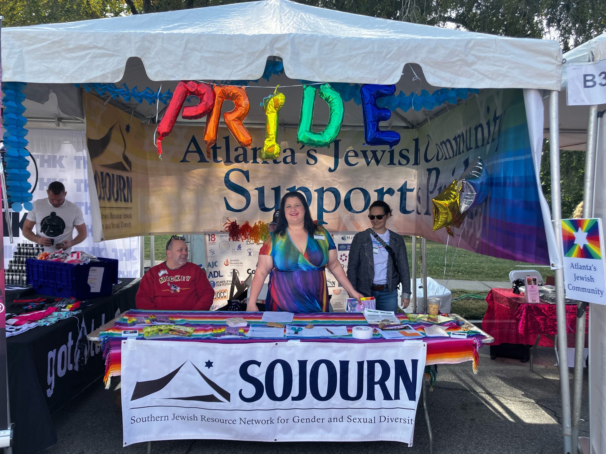 SOJOURN's Atlanta Pride booth with volunteers